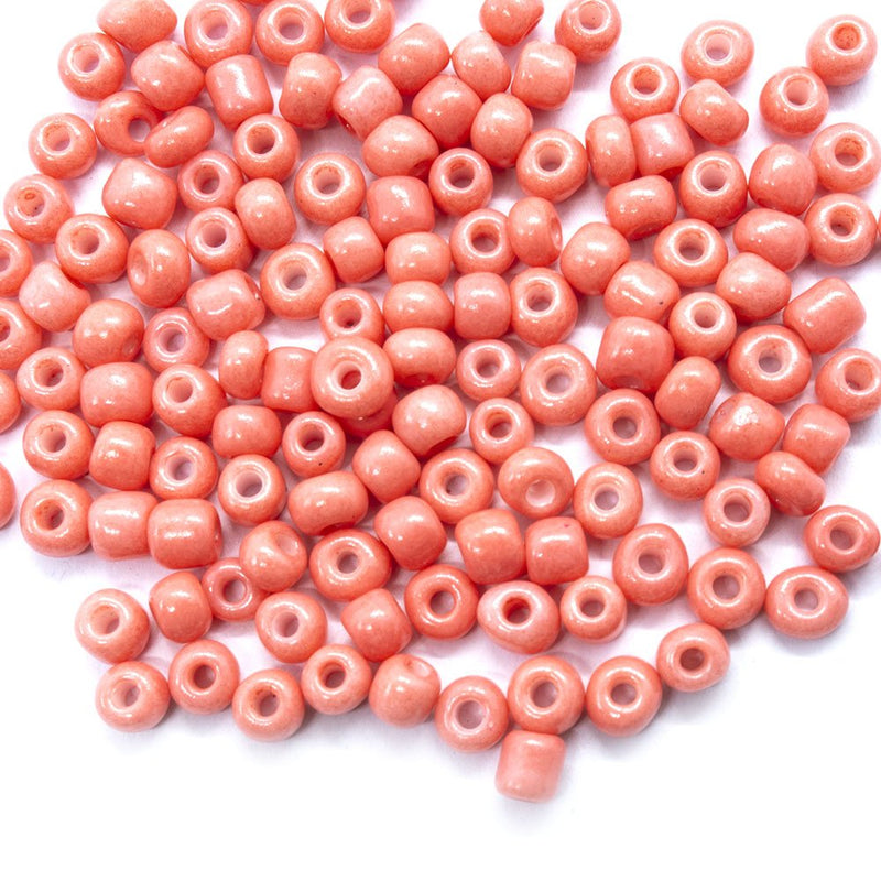 Load image into Gallery viewer, Baking Glass Seed Beads 6/0 4 - 5mm x3 - 4mm Light Coral - Affordable Jewellery Supplies
