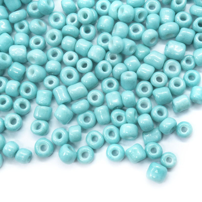 Load image into Gallery viewer, Baking Glass Seed Beads 6/0 4 - 5mm x3 - 4mm Cyan - Affordable Jewellery Supplies
